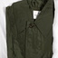 One plain green issue raincoat.