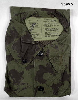 One camouflage colour issue raincoat.