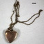 Heart shaped locket engraved with chain.