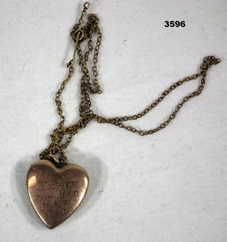 Heart shaped locket engraved with chain.