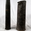 Two shell cases with damaged ends.