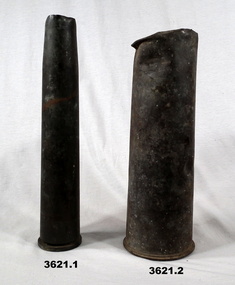 Two shell cases with damaged ends.