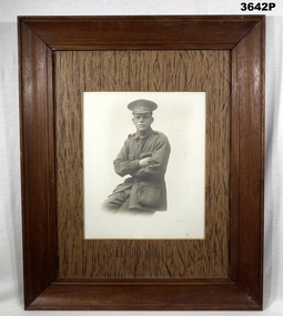 B & W photo in wood frame, WW1 soldier.