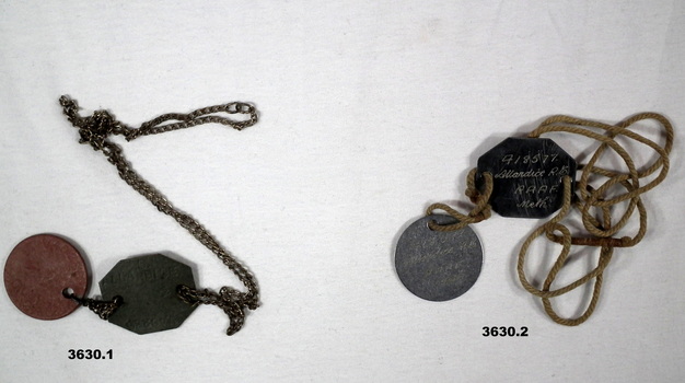 Disc with name, number, unit and religion.