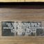 Plaque attached to the handmade wooden table