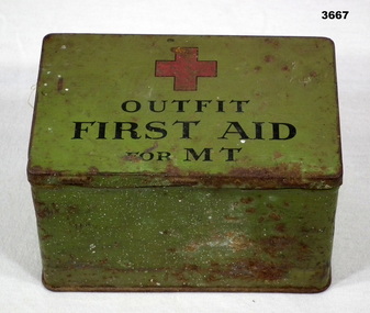 Tin, green colour, first aid kit.