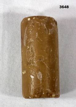 Brown cylindrical soap shaving stick