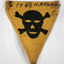 Triangular shaped badge of yellow cloth.