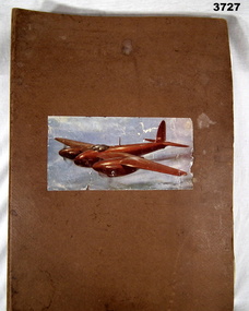 Hard cover cardboard ringed folder.