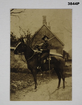 Sepia photo of a soldier on a horse WW1.