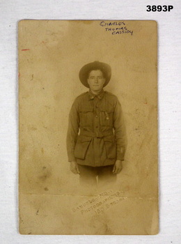 Sepia tone photo of a soldier standing.
