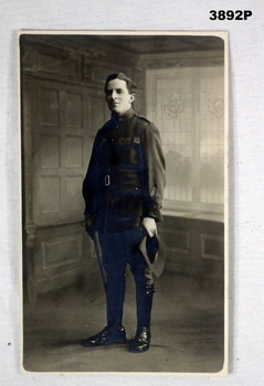Photograph of a WW1 soldier standing, studio shot.