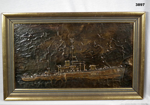 Pressed copper relief of HMAS Bendigo.