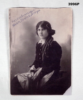 B & W photo of a lady seated with details. 