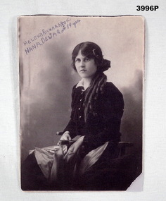 B & W photo of a lady seated with details. 