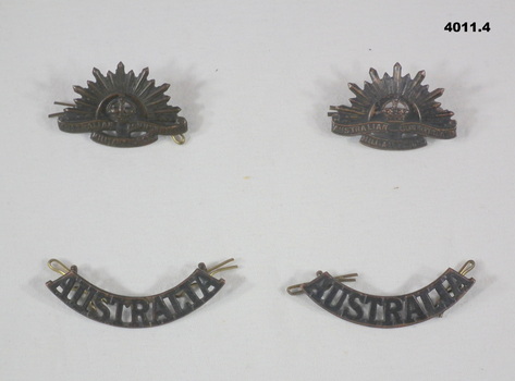 Two Rising sun and two shoulder badges.