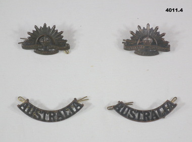 Two Rising sun and two shoulder badges.