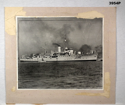 Photograph of HMAS Bendigo on card backing.