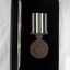Black case showing the National service medal.