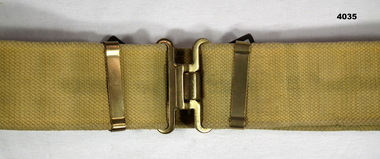Khaki colour uniform webbing belt.