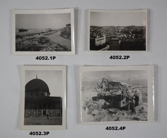 Four photographs relating to scenes in the Middle East.