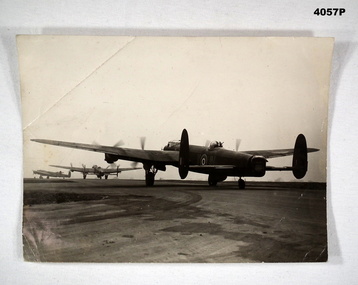 Lancaster Bombers taxiing down a runway WW2