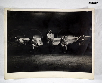 Lancaster Bomber on the runway at night