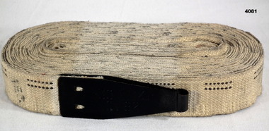 White slotted Webb belt for holding ammunition.