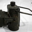 Khaki painted Battery lamp with handle and blackout cover.