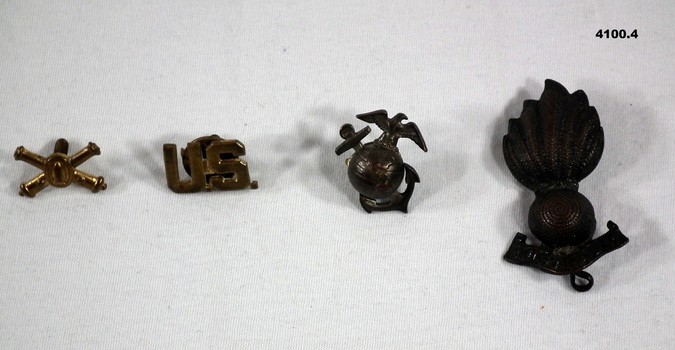 Three U.S.A and one Australian badge