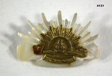 Perspex and brass brooch Rising Sun