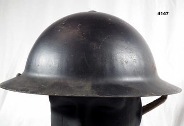 Steel helmet complete with chin strap and liner