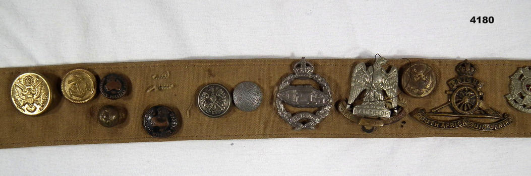 Canvas belt with a collection of Badges and buttons