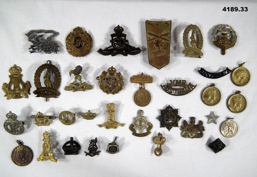 Thirty three badges of various countries and types