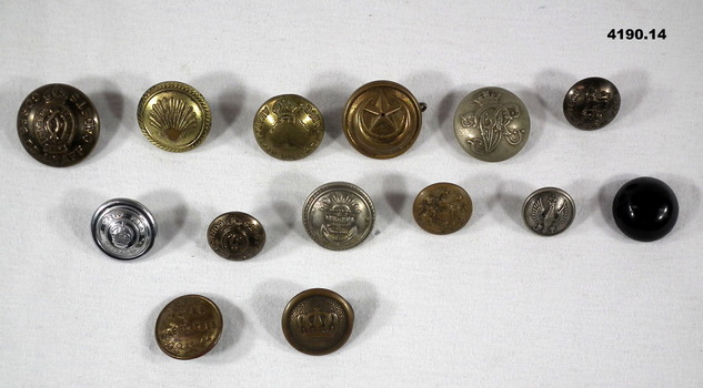 Fourteen various size uniform buttons