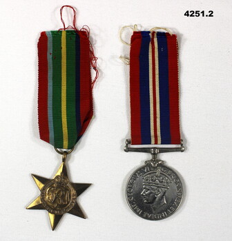 Two medals re WW2 not mounted.