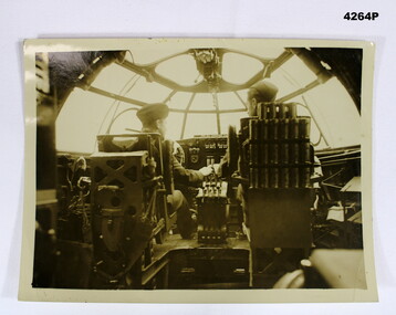 Photo with two pilots in cockpit.