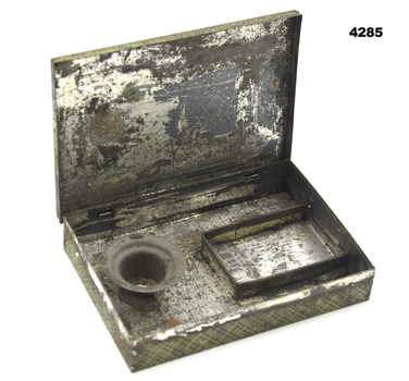 Tin called “Camp pocket candlestick”