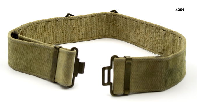 Webbing waist belt with pack pack attachment.