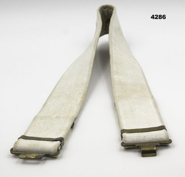White coloured webbing uniform belt.