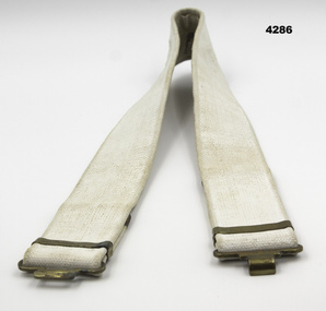 White coloured webbing uniform belt.