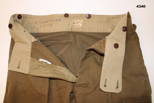 Trousers showing written owners name.