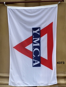 Red, white and blue YMCA Flag on pole