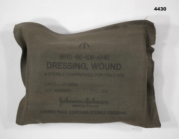 Single wound dressing in green cover