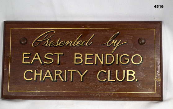 Wooden wall plaque for East Bendigo Charity Club. 