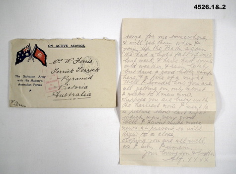 undated letter and envelope, newspaper cutting