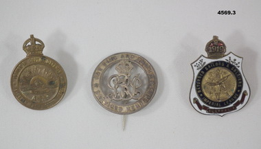 Three badges relating to WW1 service.