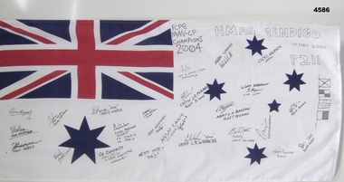 White Australian naval flag with names of ships crew from HMAS Bendigo