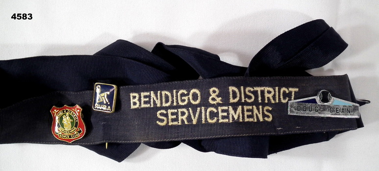 Black hat band with badges.