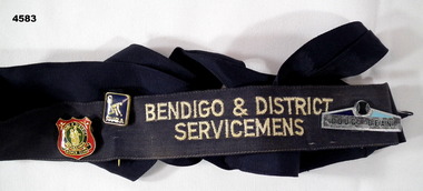 Black hat band with badges.